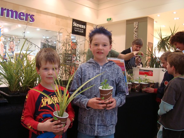 Ben and Jack Kelly collect their plants from the 'Tree Takeaway' station 